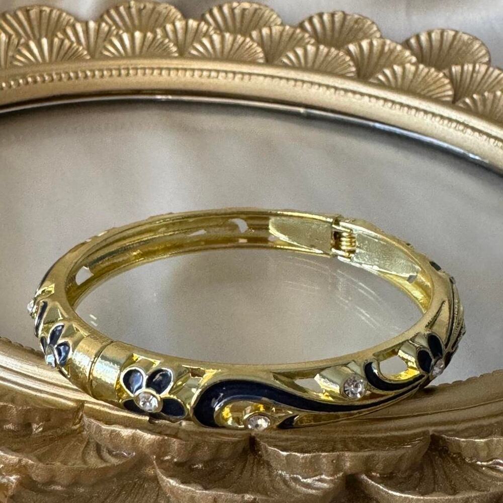 Gold bangle with black enamel